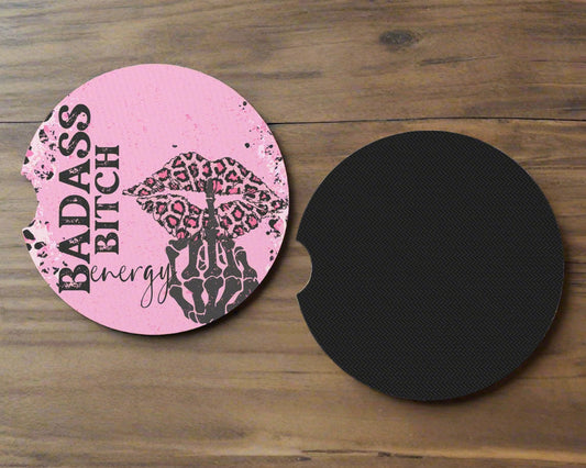 Pink leopard lips and skeleton-hand coaster design beside its black underside