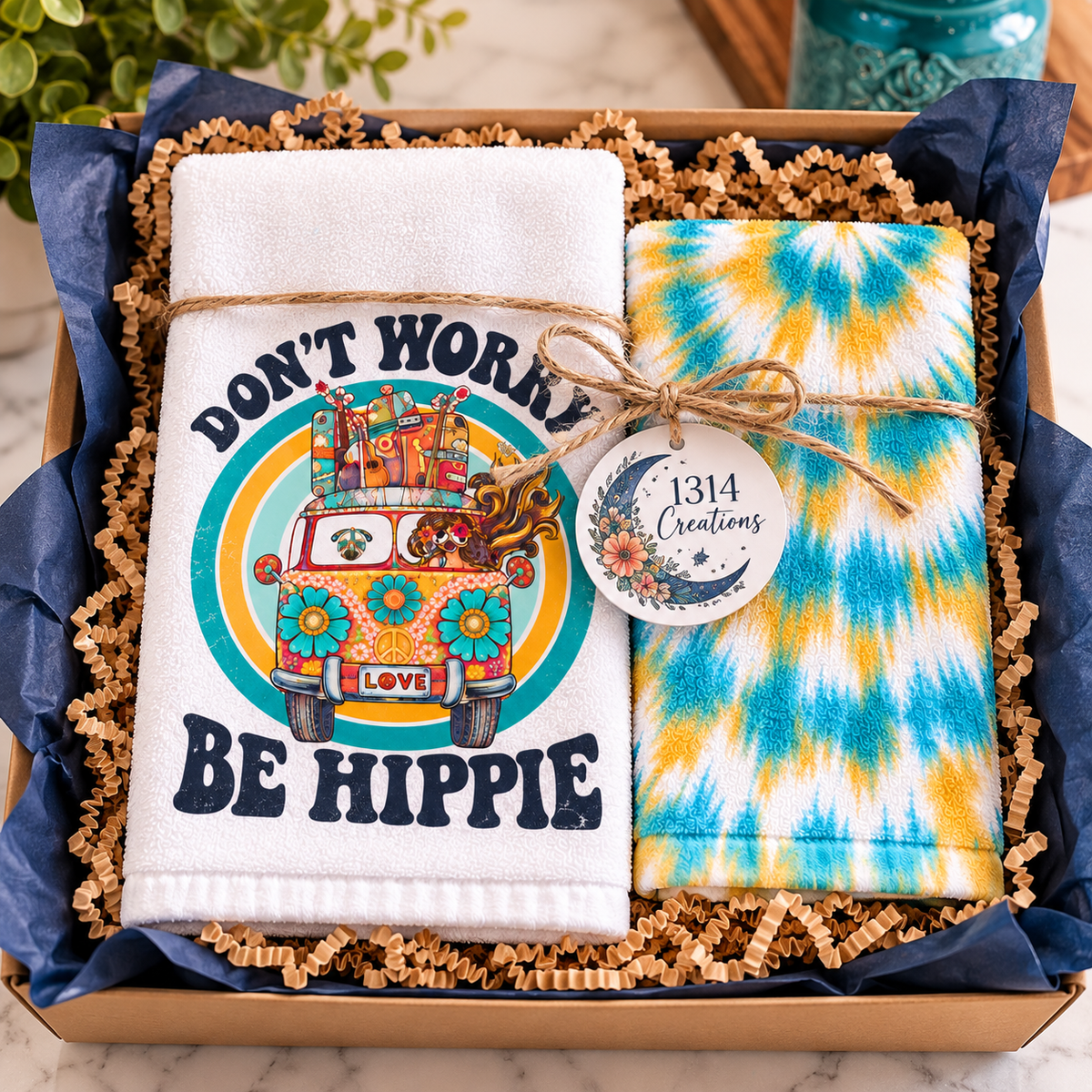 Retro van and tie-dye towels arranged in a gift box