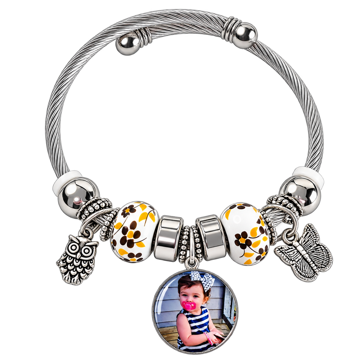 A Memory to Wear personalized photo charm bracelet with silver-tone cable band, yellow floral beads, and owl and butterfly charms.