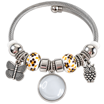 A Memory to Wear bracelet with interchangeable snap button photo fixture, showing the photo charm’s front, back, and attachment mechanism.