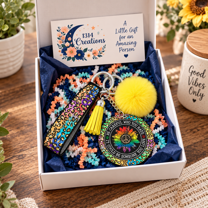 Be Careful Who You Hate wristlet keychain arranged in a gift box
