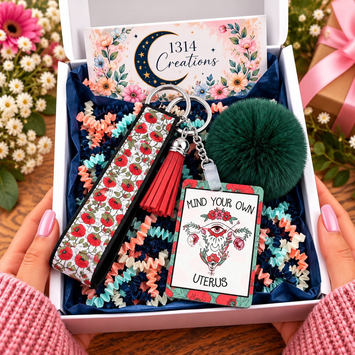 Blooms and Boundaries wristlet keychain arranged in a gift box
