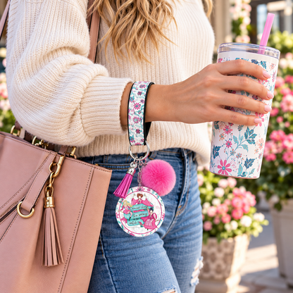 Cancer Chose the Wrong Witch wristlet worn while holding a tumbler