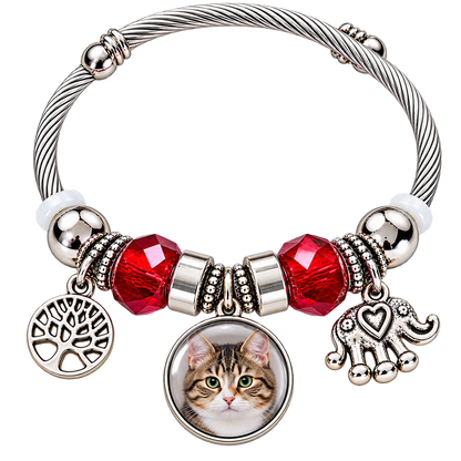 Forever in My Heart personalized pet photo bracelet with a round cat portrait, red faceted beads, and silver-tone tree of life and elephant charms.