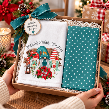 Christmas gnome and teal polka-dot towels arranged in a gift basket