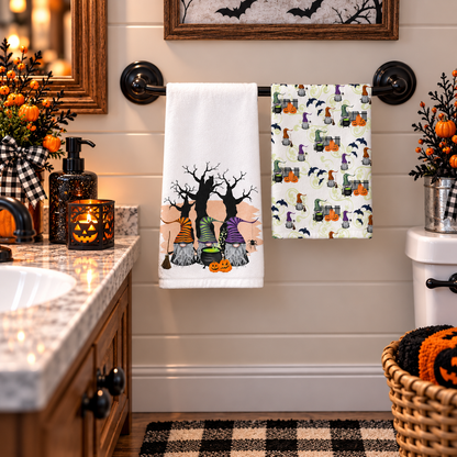 Gnomes, Spells & Spooky Tales Halloween hand towel set hanging beside a bathroom vanity with autumn decorations