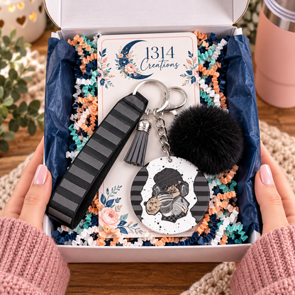 Headphones On World Off wristlet keychain arranged in a gift box