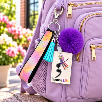 Hope Beyond the Pause wristlet keychain hanging from a backpack