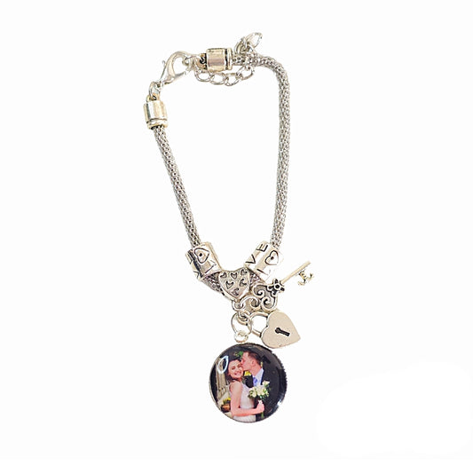 Keys to My Heart personalized photo bracelet with a silver-tone chain, decorative beads, heart-shaped lock, key charm, and round couple photo charm.