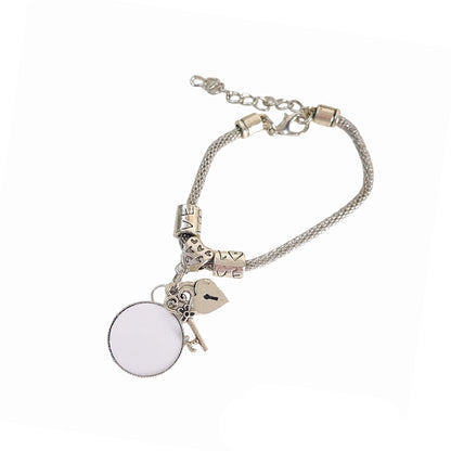 Full view of Keys to My Heart bracelet with a blank photo charm, heart lock and key charms, silver-tone beads, and adjustable extender chain.