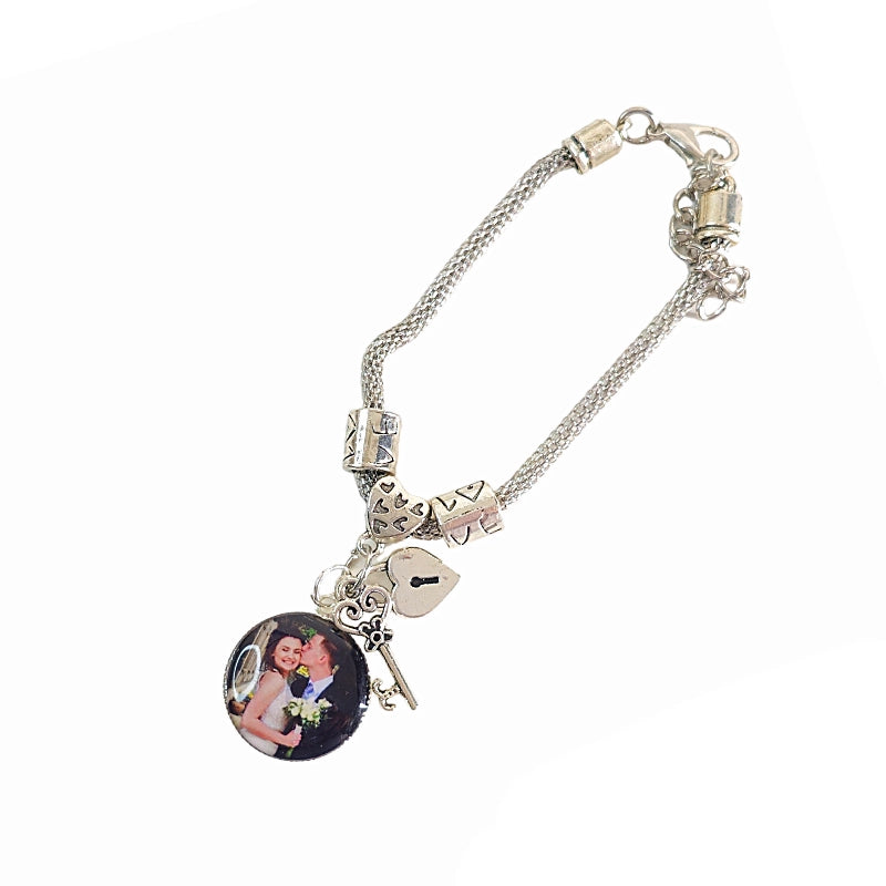 Angled Keys to My Heart personalized bracelet with a couple photo charm, silver-tone decorative beads, and dangling heart lock and key charms.