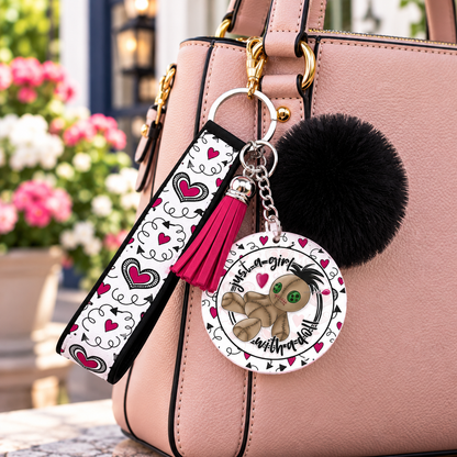 Love Me to Pieces wristlet keychain hanging from a purse