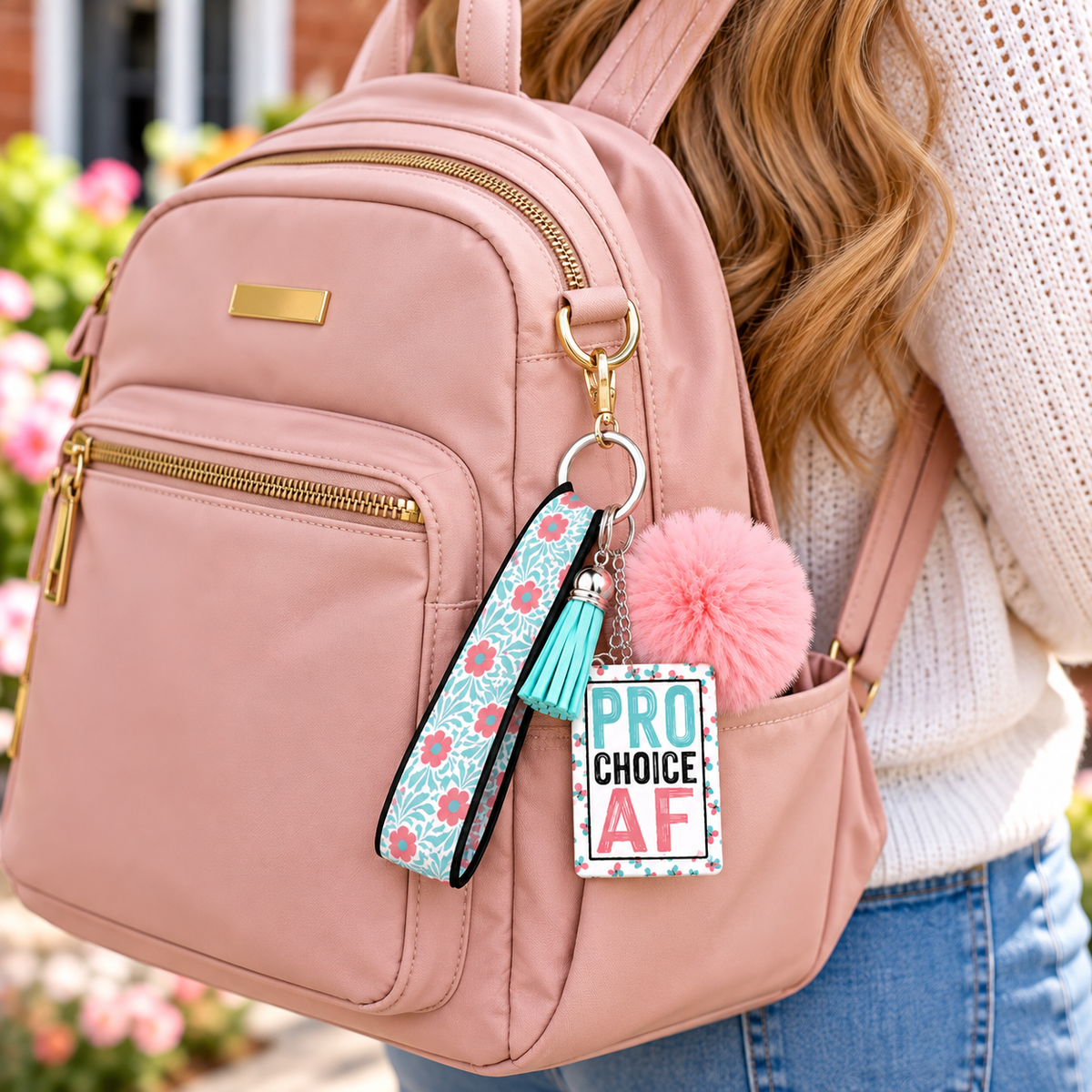 My Choice in Full Bloom wristlet keychain hanging from a backpack
