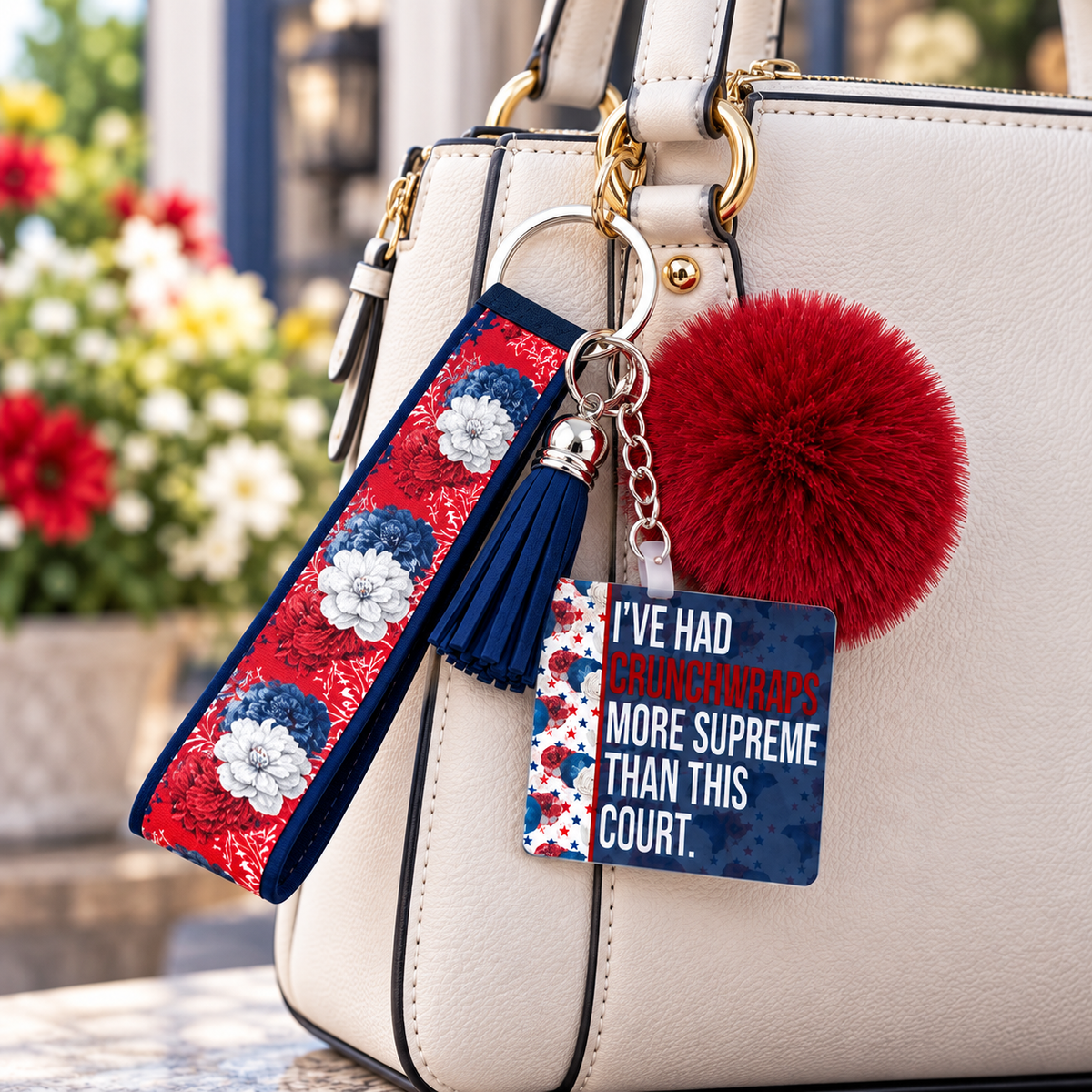Supreme Disappointment wristlet keychain hanging from a purse