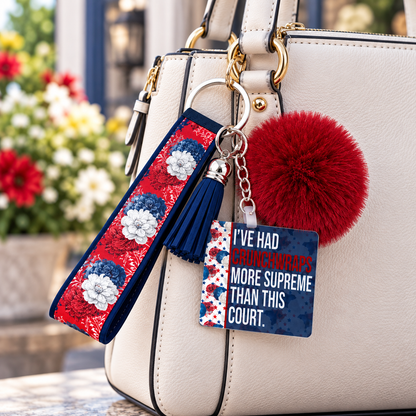 Supreme Disappointment wristlet keychain hanging from a purse