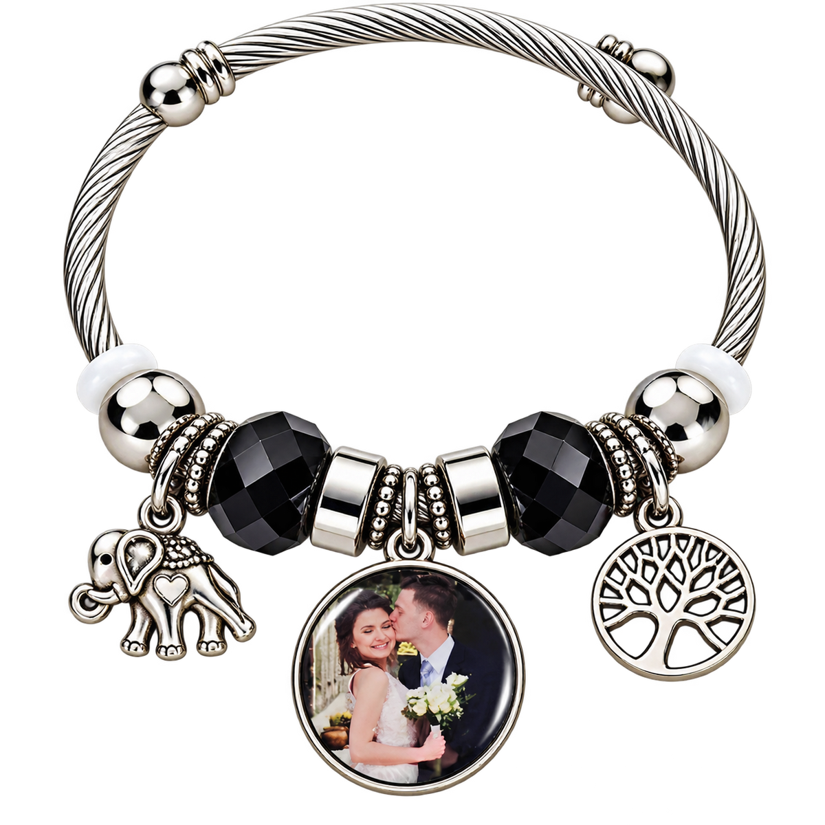 Black-and-silver personalized photo bracelet with elephant and Tree of Life charms on a black background