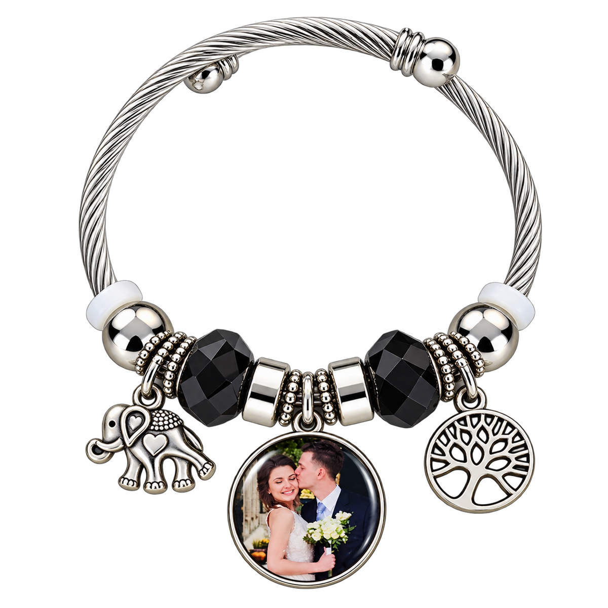 Personalized round photo charm on a black-and-silver bracelet with elephant and Tree of Life charms