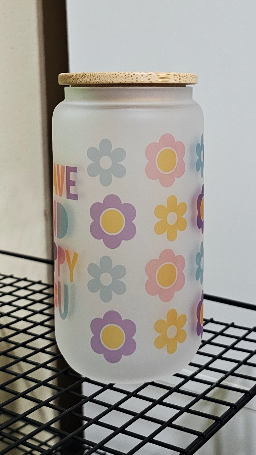 An uplifting 16oz frosted glass tumbler adorned with delicate floral patterns and the inspiring message 'Always Be You'. The tumbler features vibrant colors and a sturdy design, perfect for staying hydrated with style. 🌸 #AlwaysBeYou #GlassTumbler #PositiveVibes