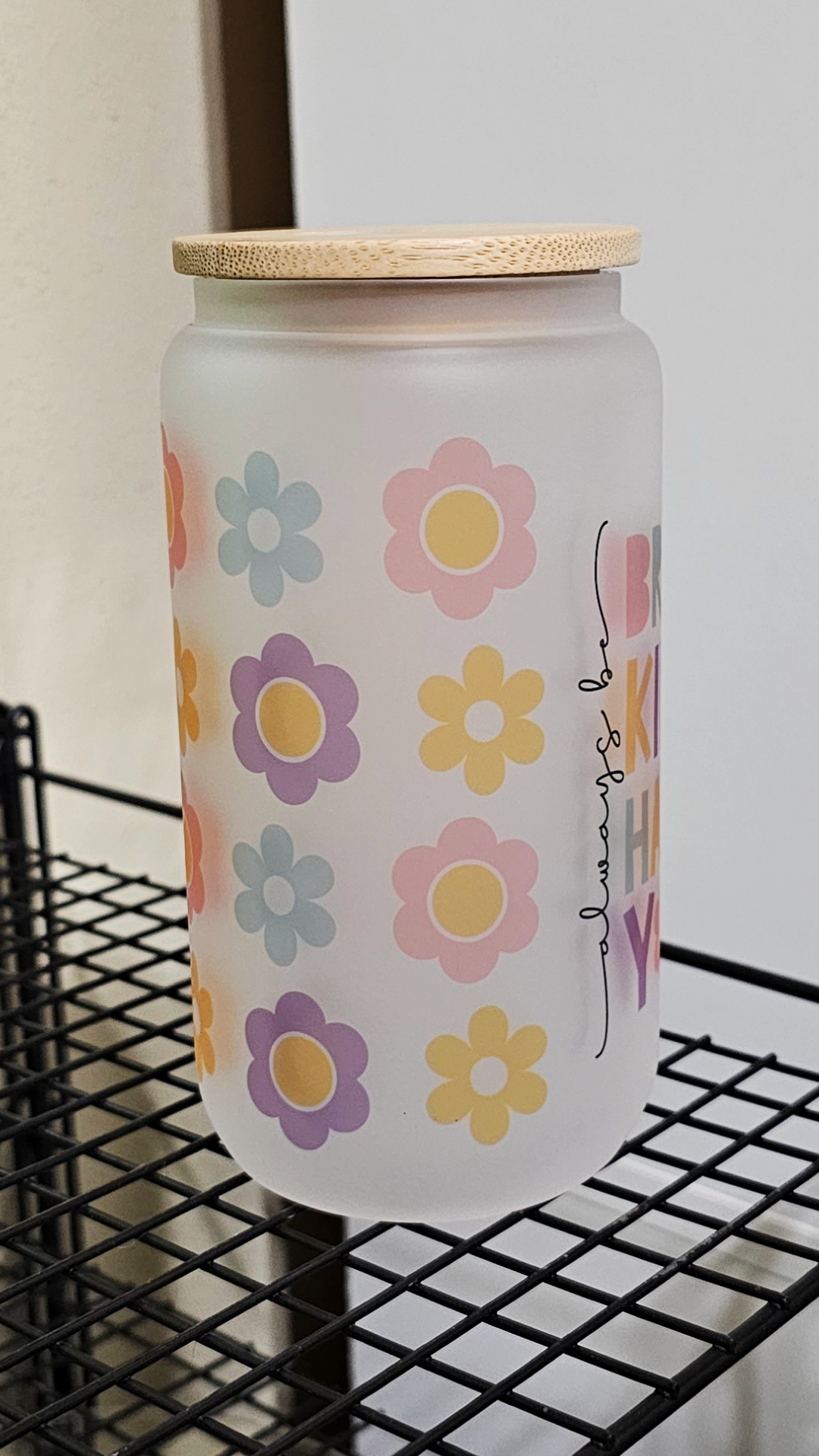 An uplifting 16oz frosted glass tumbler adorned with delicate floral patterns and the inspiring message 'Always Be You'. The tumbler features vibrant colors and a sturdy design, perfect for staying hydrated with style. 🌸 #AlwaysBeYou #GlassTumbler #PositiveVibes