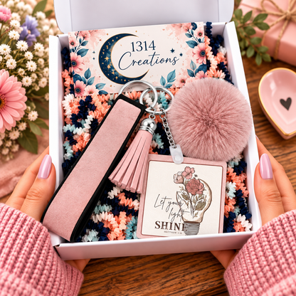 Where Your Light Blooms wristlet keychain arranged in a gift box