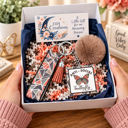 Anti-Social Butterfly wristlet keychain arranged in a gift box