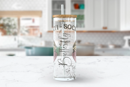 A 25oz clear glass tumbler with 'Anti Social Butterfly' printed on the side, accompanied by delicate butterfly wings