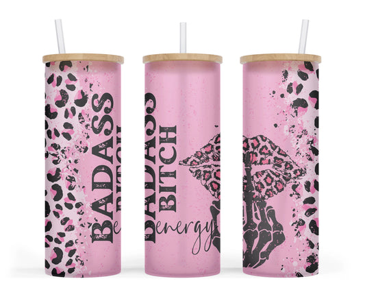 A 25oz frosted glass tumbler with a pink leopard print skeleton design and the words 'Badass Bitch Energy' on it