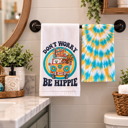 Don't Worry Be Hippie towel set hanging beside a bathroom sink