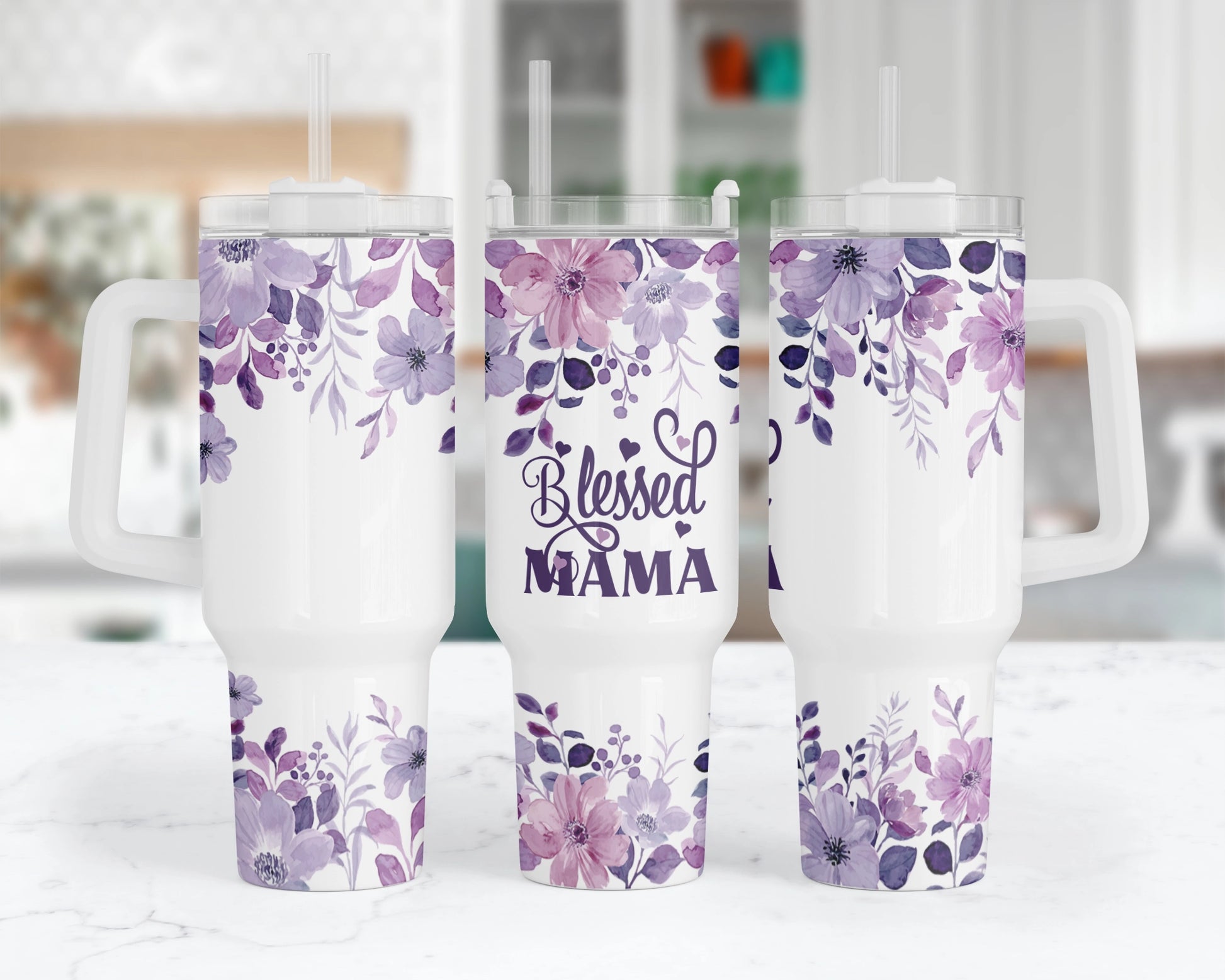 A 40oz tumbler with a white handle featuring a purple floral design and the words 'Blessed Mama'