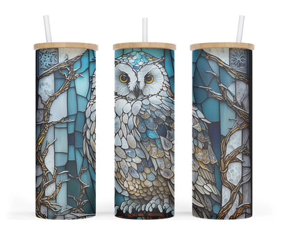  A 25oz frosted glass tumbler with a blue and white stained glass design featuring an owl perched on a branch.