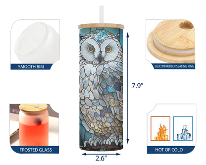  A 25oz glass tumbler with a blue and white stained glass design featuring an owl perched on a branch.