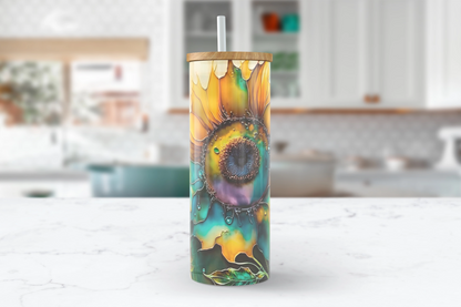 A 25oz clear glass tumbler featuring a vibrant sunflower resembling artwork crafted with alcohol inks