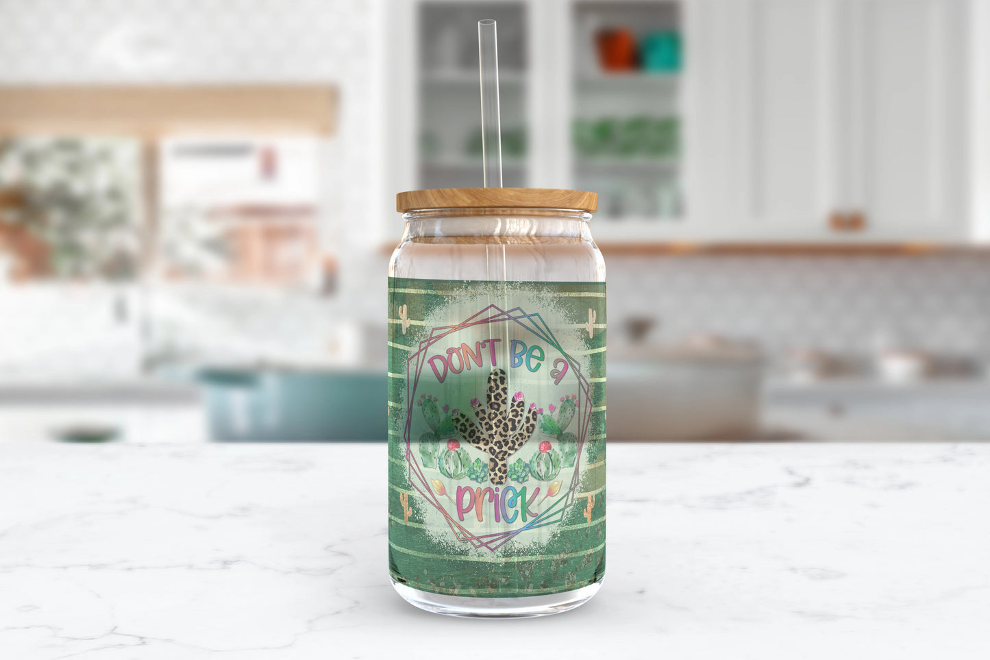 A 16oz clear glass tumbler featuring a cactus design with the words 'Don't Be A Prick'