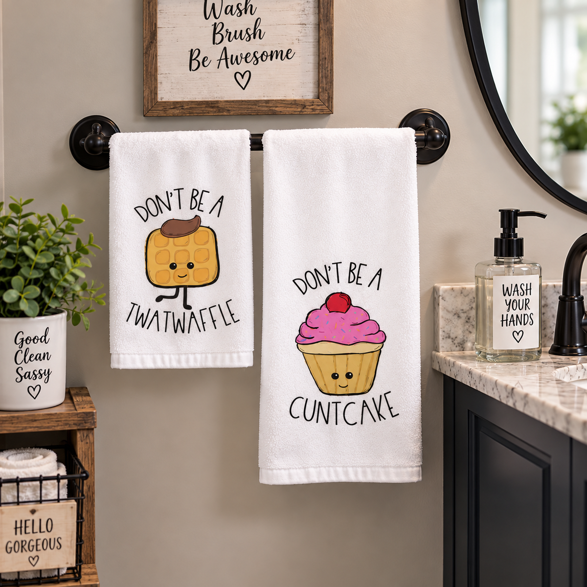 Syrup Sprinkles & Sass two-piece hand towel set featuring cowboy waffle and pink cupcake with adult-humor sayings, displayed beside bathroom sink