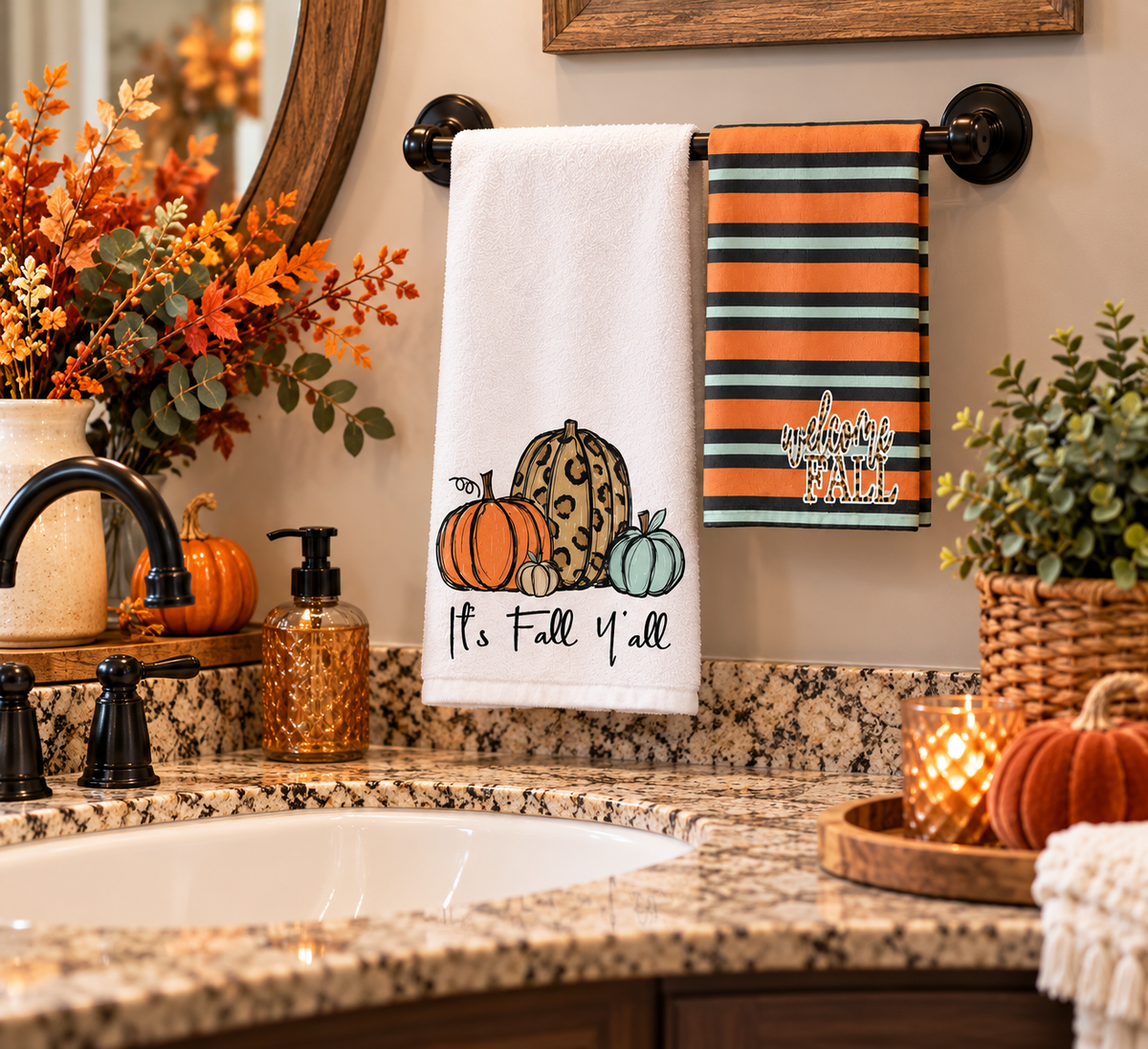 Pumpkin and Welcome Fall towels displayed in an autumn bathroom
