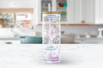 A 25oz clear glass tumbler cup adorned with positive quotes and a playful purple design, inspiring you to take on the day with style and motivation