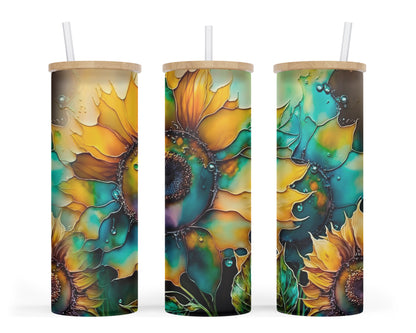 A 25oz frosted glass tumbler featuring a vibrant sunflower resembling artwork crafted with alcohol inks